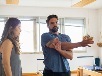 Man stretching his arms after a successful workout session.